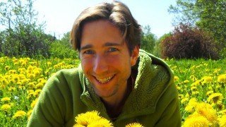 Jesse Bogdanovich in a dandelion field