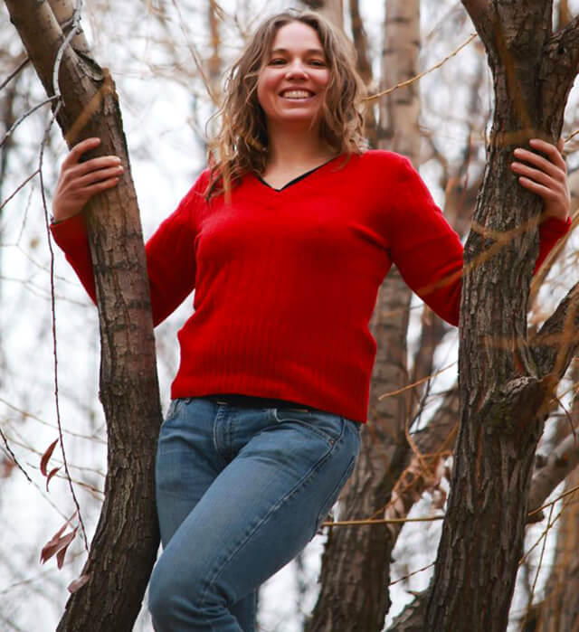 Victoria Everett posing in a tree