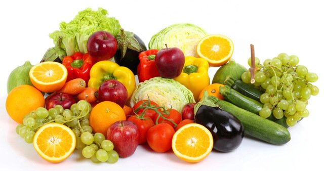 Fruits and vegetables in a large pile on a white background