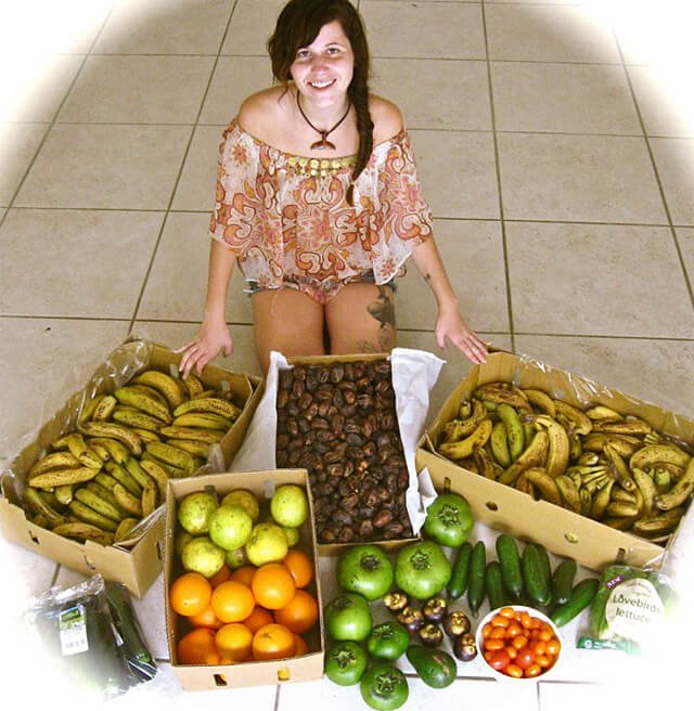 Tarah Millen photographed with several boxes of fruit