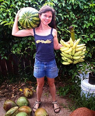 Janie Gardener holds watermelon and bananas
