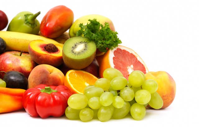 Fresh fruits stacked atop one another
