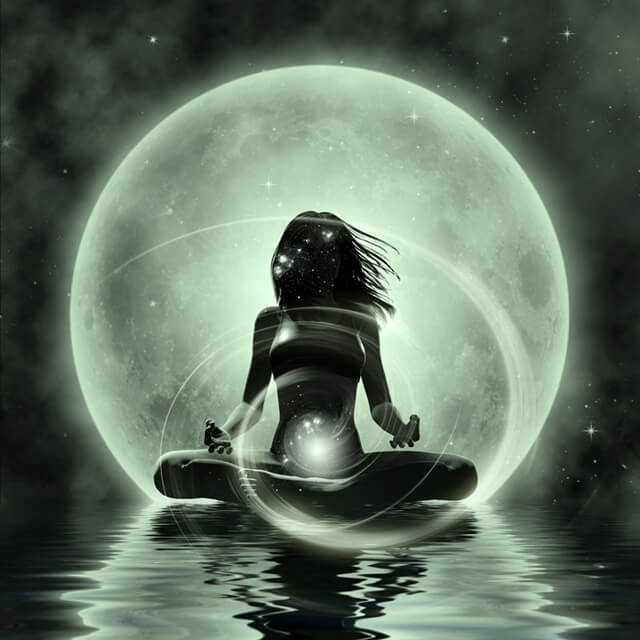 Woman practices moonlight yoga on the water