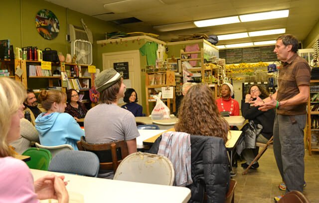 Arnold's Way owner Arnold Kauffman addresses potluck gatherers in February 2013