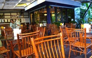 The beautiful, inviting patio section at Rasayana Raw Café in Bangkok, Thailand