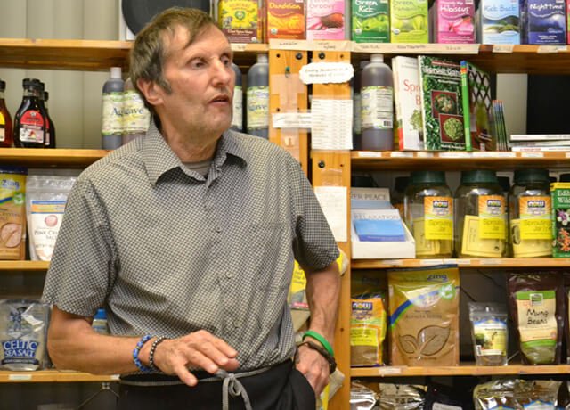 Arnold's Way owner Arnold Kauffman chats with patrons at a potluck