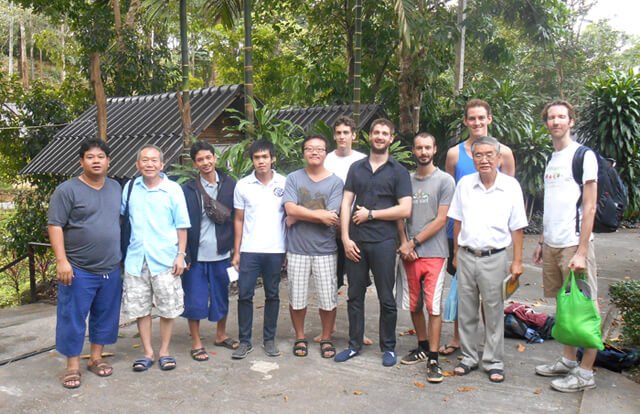 Men are photographed on the last day of a Vipassana meditation retreat in Kanchanaburi, Thailand