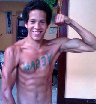 Kevin Rogers flexes his left bicep