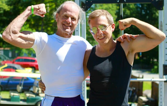 Mike Vlasaty flexes muscles with Dr. Doug Graham at the 2013 Woodstock Fruit Festival