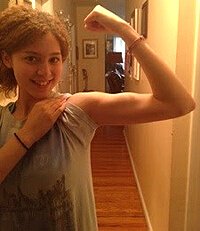 Miliany Bonet flexes a bicep