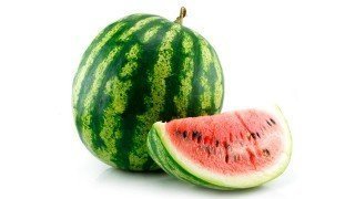 A whole watermelon and a large slice