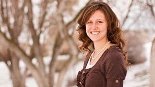 Jessica Fuller photographed with a snowy background.