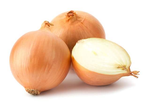 Two-and-a-half onions against a white background