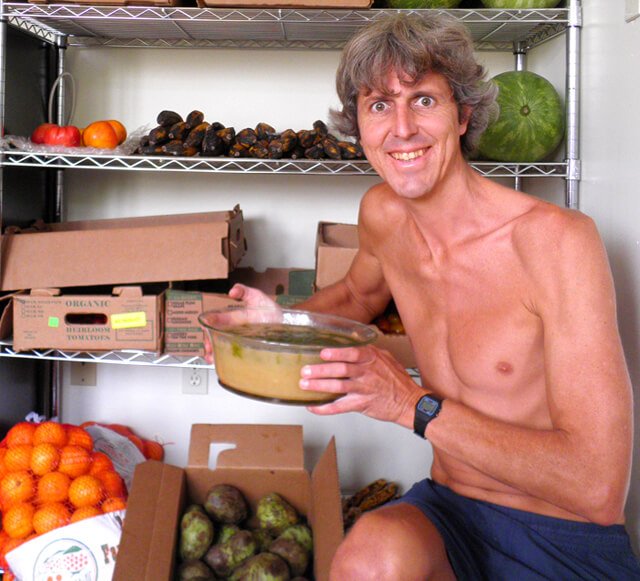 Grant Campbell poses while holding food