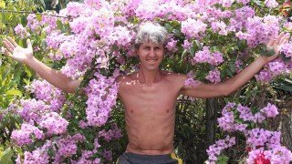 Grant Campbell amid blooming flowers