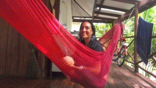 Jenee-Hallick-sitting-on-a-hammock