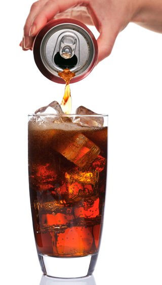 Cola being poured against white background
