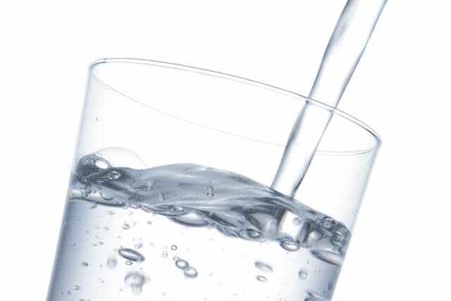 Water is poured into a glass