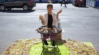 Ashley Clark is roadside and surrounded by bananas