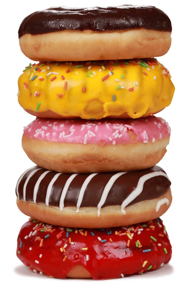 A stack of five doughnuts against a white background