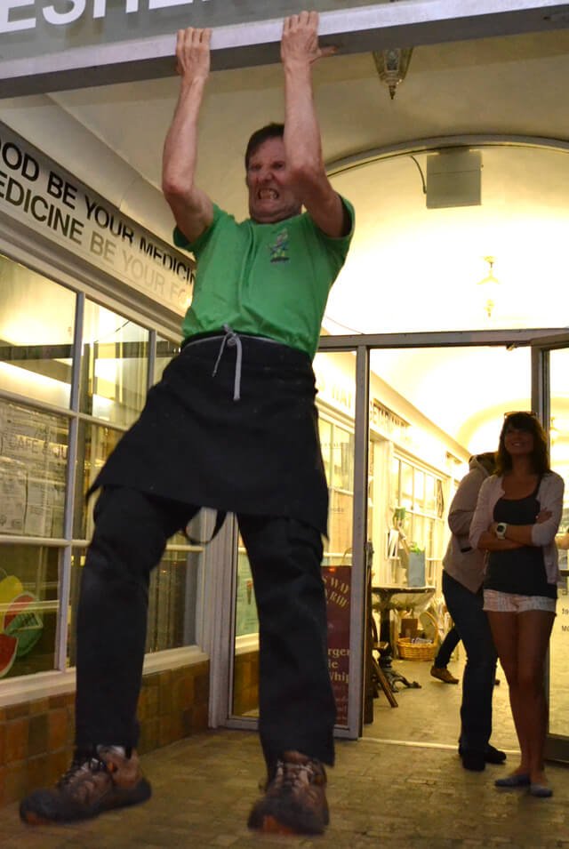 Arnold Kauffman practicing chin-ups outside Arnold's Way