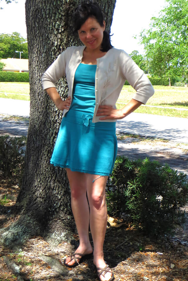 Joy King smiling in front of a tree