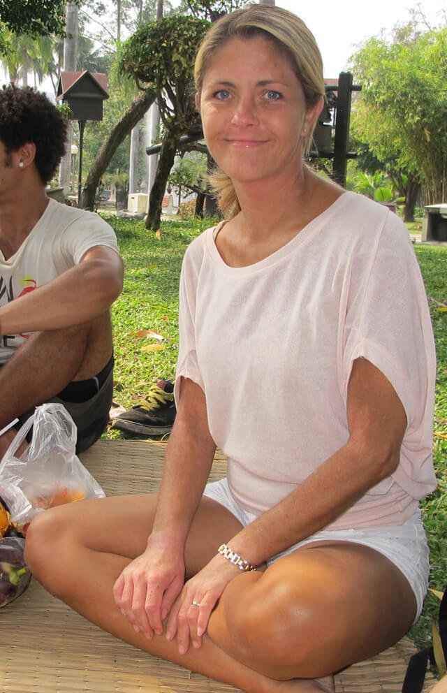 Louise Koch poses for a photograph in a Thailand park