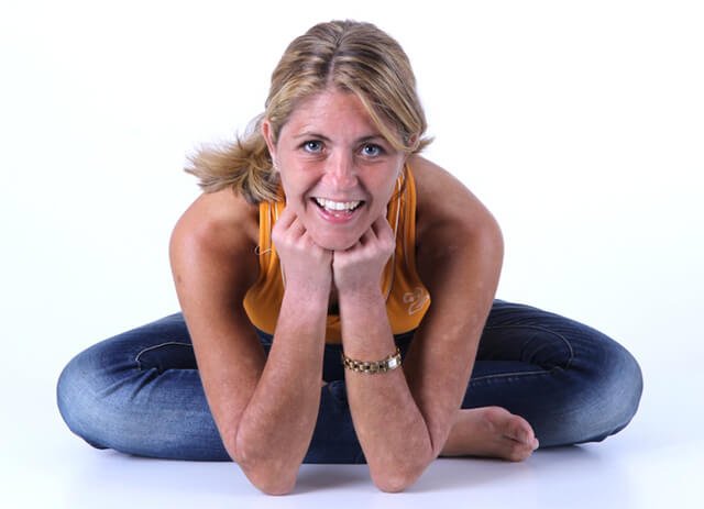 Louise Koch leans forward with her chin resting on her hands
