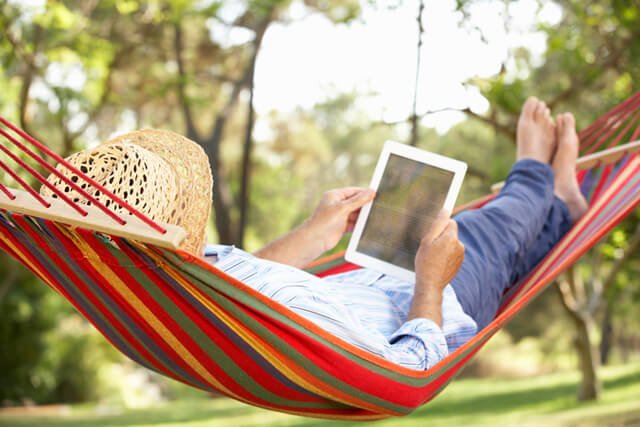 Man reading on a hammock