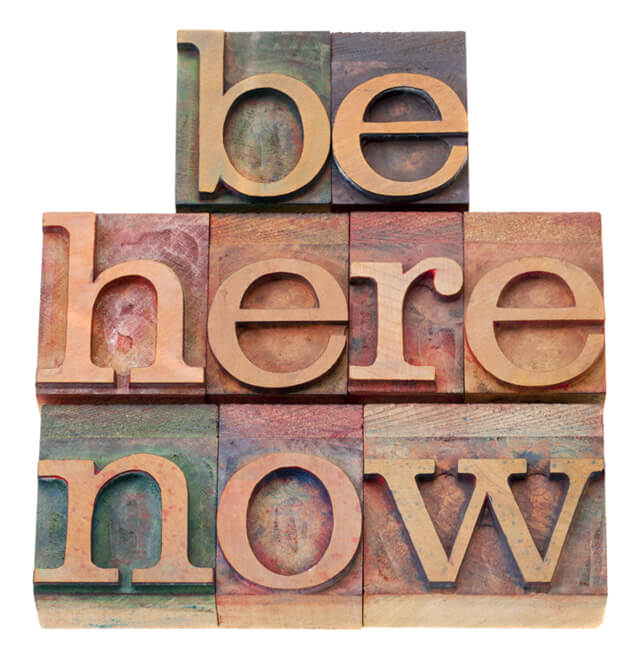 Be here now in block letters