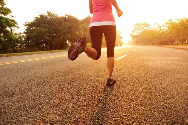 A woman runs in a street