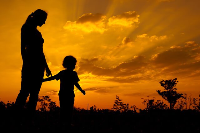 Mother and child at sunset