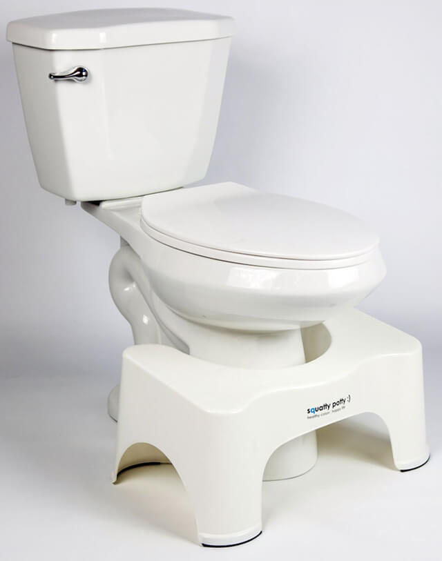 A Squatty Potty Ecco model next to a toilet