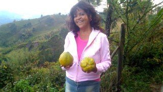 Toni-Allen-holding-two-tropical-fruits