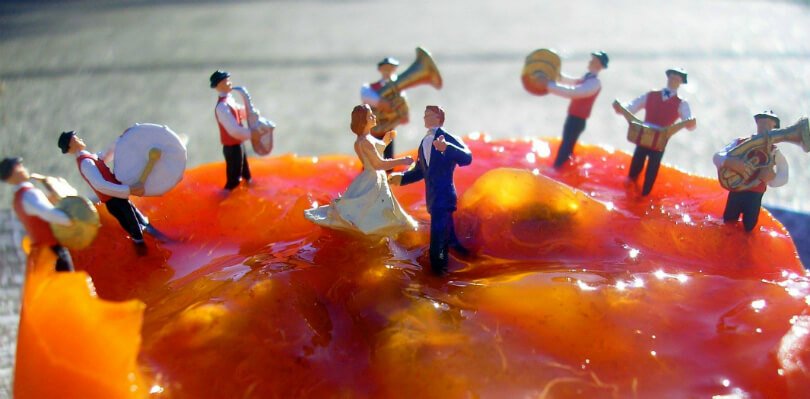 Fruit art by Anne Osborne - men and women enjoy song and dance over a persimmon - Fruit-Powered