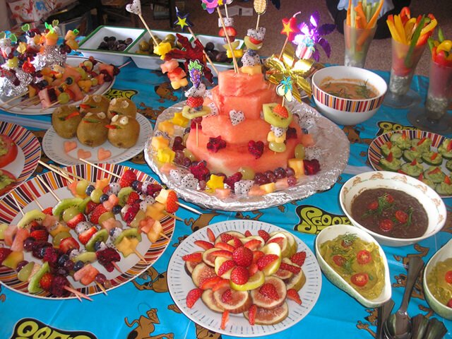 A tableful of fruits and vegetables at a birthday party put on by Anne Osborne