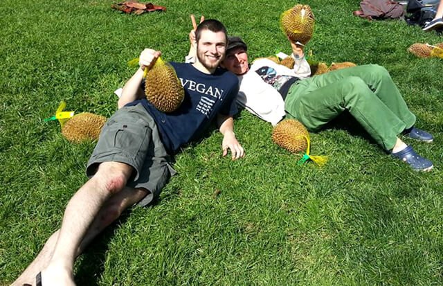 Benjamin Beeler holds durian at a fruitluck