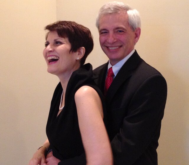 Irene Bojczuk smiles with Doug at a formal event