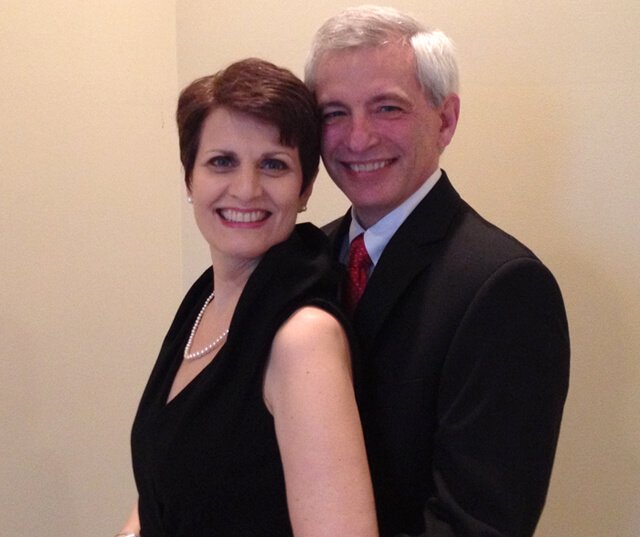 Irene Bojczuk smiles with Doug at a formal event