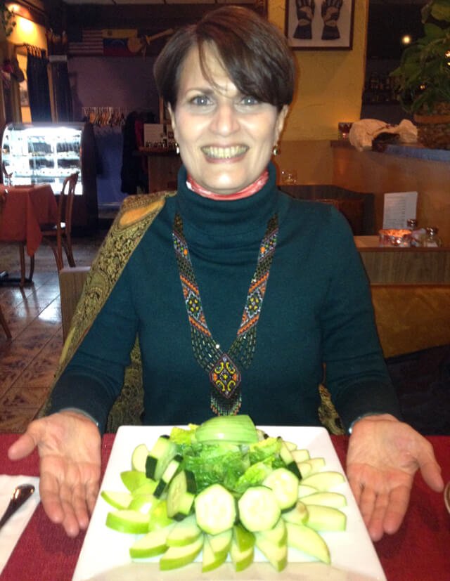 Irene Bojczuk is photographed presenting a fruit platter she ordered at a restaurant