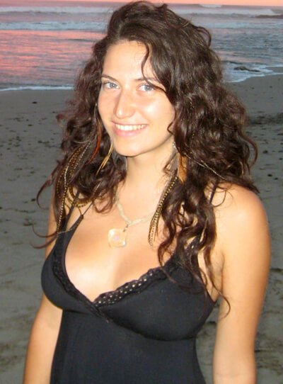 Gabriela Ranzi poses in a dress on a beach