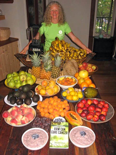 Janette Murray-Wakelin behind a mound of fruit and her book