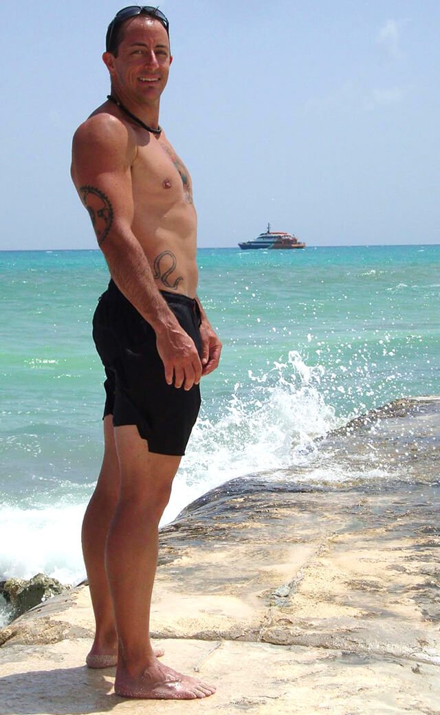 Victor VanRambutan poses on a sunny day at a beach