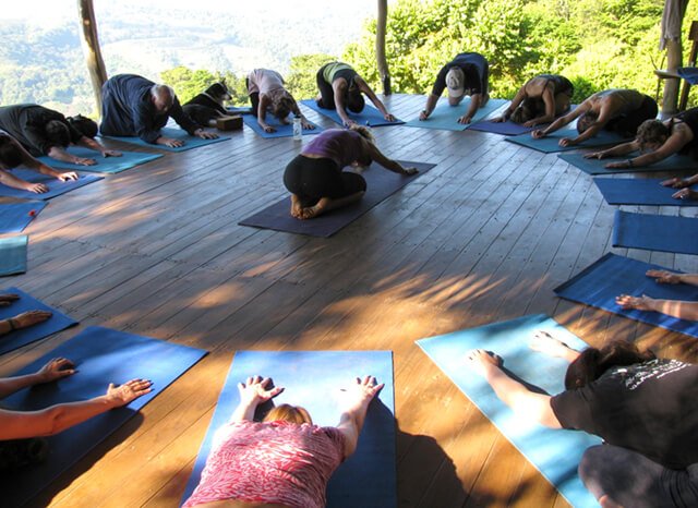 Ellen Livingston leads a yoga session in a circle