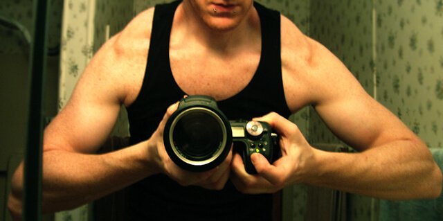 Timothy Radley, a.k.a. Veganbadass, flexes his upper-body muscles