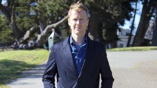 Timothy Radley poses wearing a sports coat