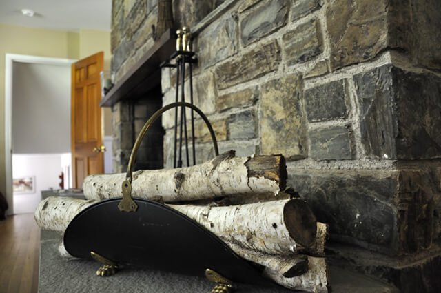 Wood stacked next to a fireplace