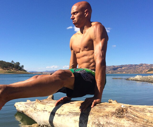 Cyrus Khambatta exercises outdoors by water