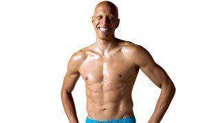 Cyrus Khambatta poses with his shirt off