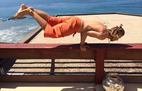 Evan Rock practices yoga outside